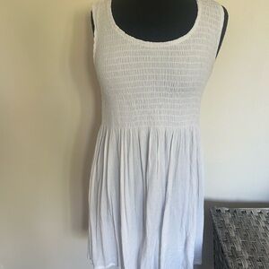 Vasna dress with  smocked upper, light flowy pleats on lower half , Size S